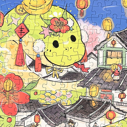 Close-up of the green cartoon dragon character in the Draw Snake puzzle, decorated with flowers and lanterns