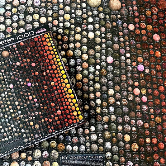 Completed Universe puzzle with box placed over detailed grid of rocky and icy planets