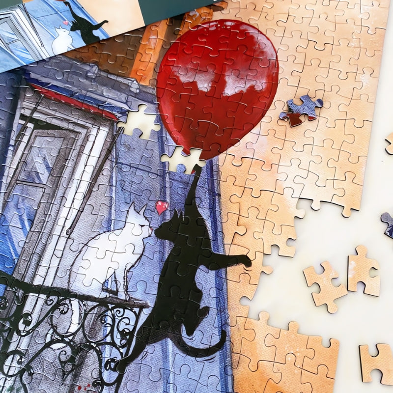 Partially completed Cat Love puzzle with red balloon and black cat reaching toward a white cat