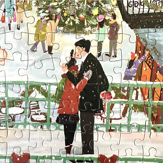 Puzzle detail showing romantic couple kissing beside railing in snowy holiday scene.