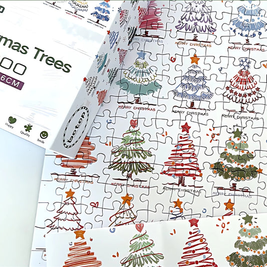 Christmas Trees puzzle partially assembled, with the box and several decorated tree designs visible