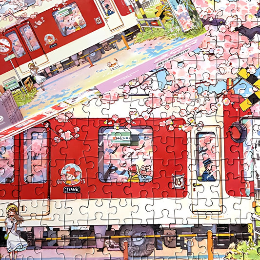 Assembled Sakura Train puzzle laid flat with box lid beside, featuring cherry blossoms and detailed train illustration