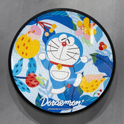 Round puzzle of Doraemon smiling with arms raised, surrounded by vibrant tropical leaves and fruit.