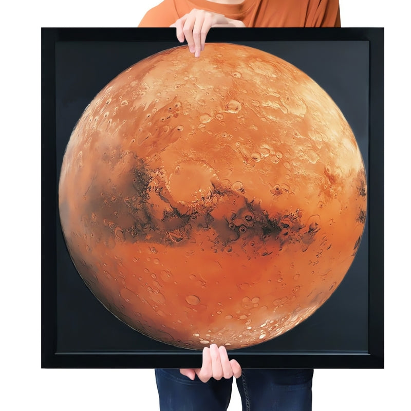 Framed Mars puzzle being held, displaying vivid red-orange Martian surface.