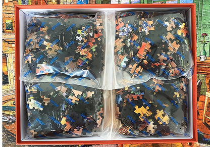 Four sealed bags of puzzle pieces inside the Botop Vacation Home puzzle box