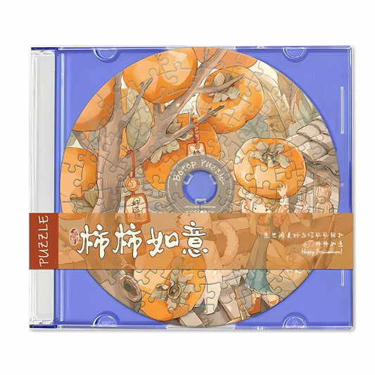 CD-shaped puzzle in blue case showing persimmons and playful characters – fruit mini puzzle.