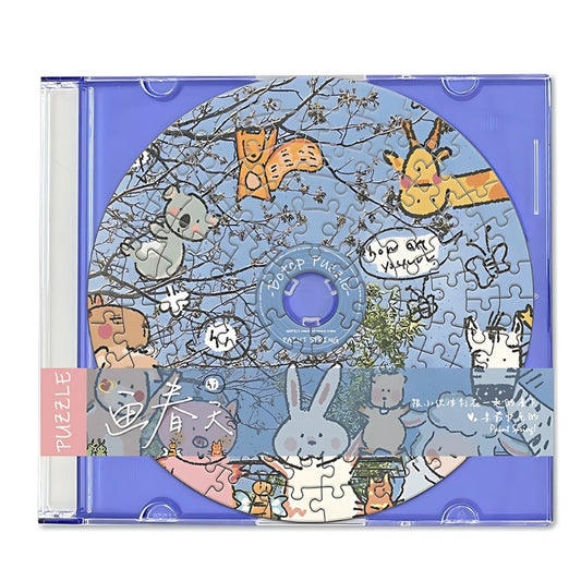 Puzzle inside blue jewel case with bunny and giraffe art – cute animal puzzle.