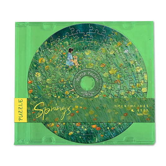 CD-shaped puzzle in green case with girl and dog in a meadow – nature mini puzzle.