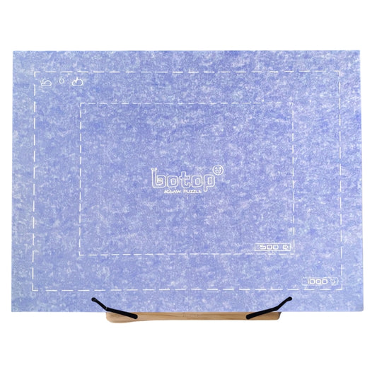 Foldable puzzle board in ice blue displayed on a wooden adjustable easel.