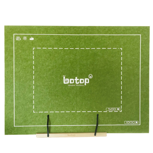 Foldable puzzle board in olive green displayed on a wooden adjustable easel.