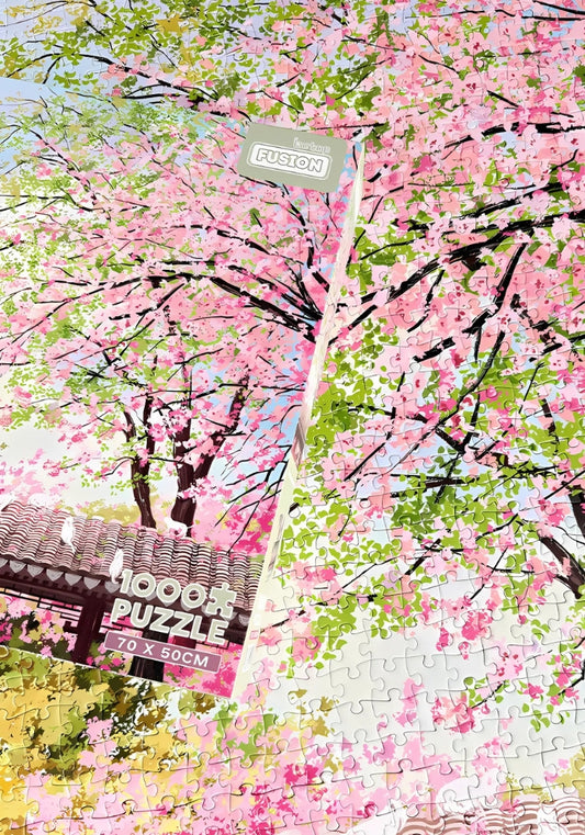 Spring on Earth puzzle assembled with box placed on top, showcasing design accuracy and soft floral palette.