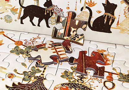 Puzzle pieces close-up from Tang Dynasty set showing gold foil details and colour accents