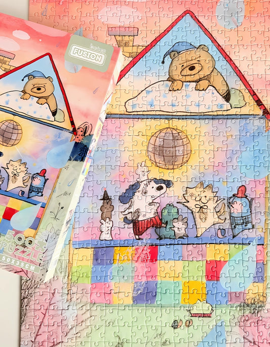 Completed Dancing Party puzzle with box on top, showing full scene of a bear sleeping as animals dance below.
