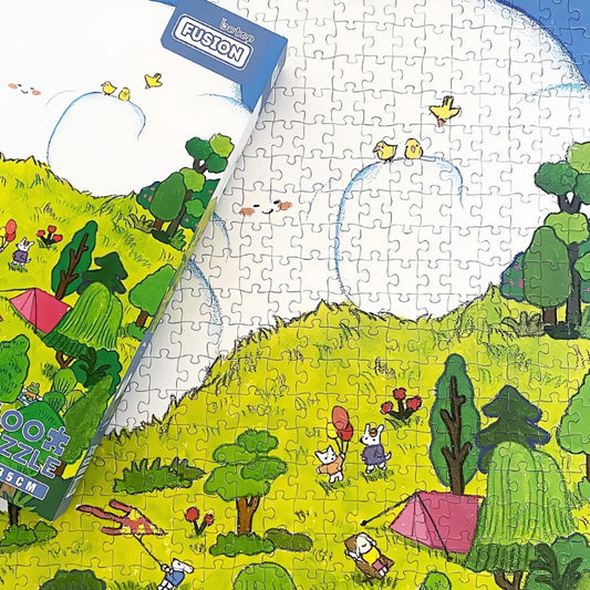 Partially completed puzzle with box placed over the matching scene.
