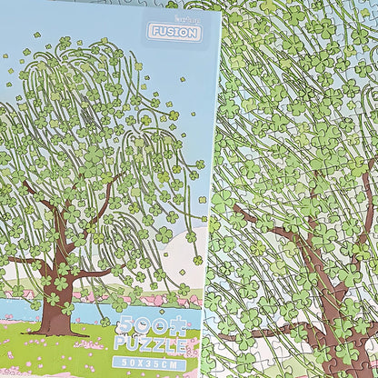 Side angle view of Lucky Tree puzzle box highlighting the pastel artwork and 500 piece count