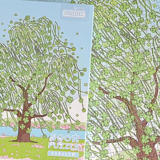 Side angle view of Lucky Tree puzzle box highlighting the pastel artwork and 500 piece count