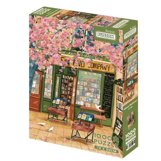Sakura Bookstore 1000 puzzle box, featuring a quaint green bookstore under cherry blossom trees with book displayed outside.