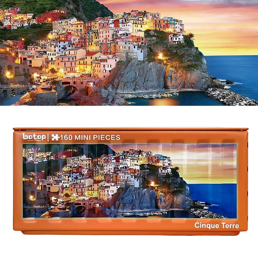 Colourful coastal village at sunset on Cinque Terre puzzle with orange tin container.0