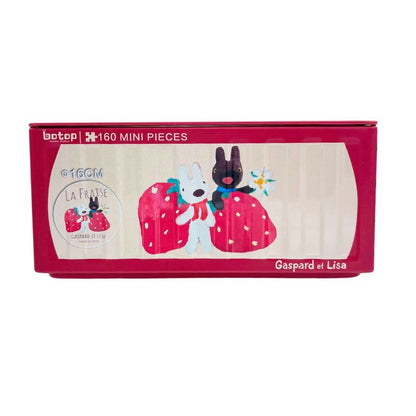 Red Botop puzzle tin featuring Gaspard and Lisa holding giant strawberries with “La Fraise” theme.