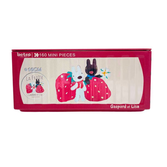 Red Botop puzzle tin featuring Gaspard and Lisa holding giant strawberries with “La Fraise” theme.