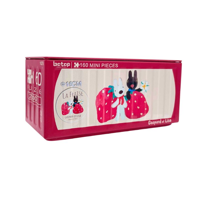 Red Botop puzzle tin featuring Gaspard and Lisa holding giant strawberries with “La Fraise” theme.