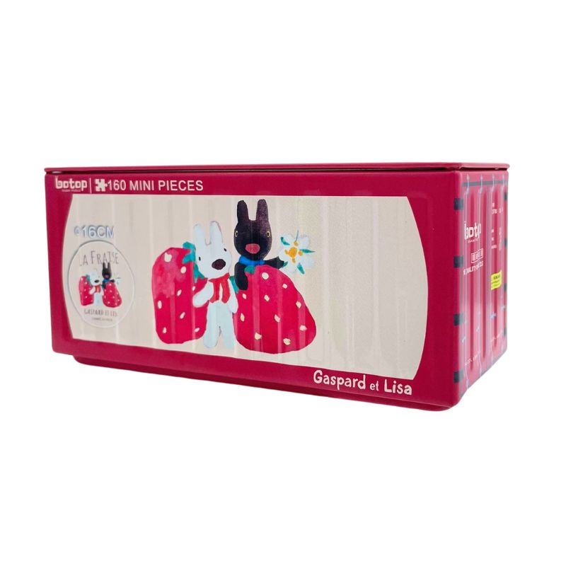 Red Botop puzzle tin featuring Gaspard and Lisa holding giant strawberries with “La Fraise” theme.