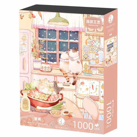 Puzzle packaging of the Warm Company puzzle by Gill & Lill, showing a heartwarming kitchen scene with cats.