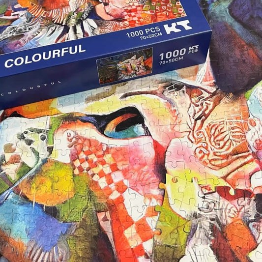 Colourful Keytime 1000 piece puzzle box next to partially assembled cat portrait puzzle with velvet finish.