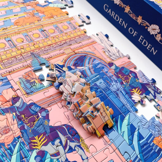 Partially assembled Garden of Eden 1000 piece puzzle showing pink and blue architectural details with velvet finish
