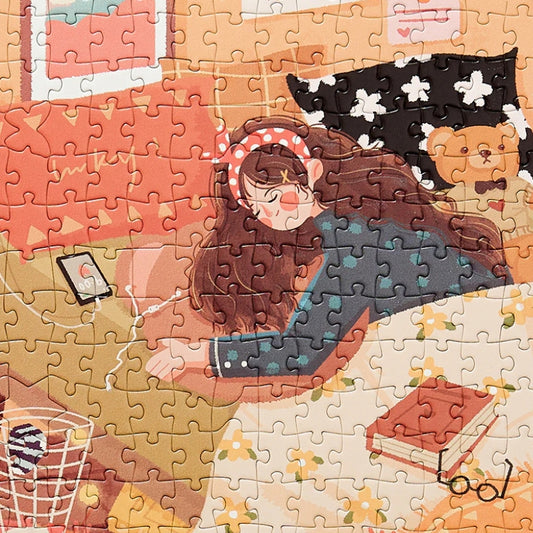 Close-up of partially completed jigsaw puzzle showing a girl in bed with long hair, wearing a headband, and a teddy bear in the background.