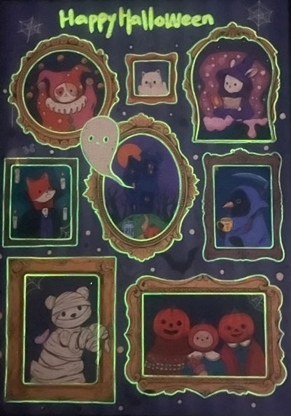 Glow-in-the-dark view of the completed puzzle showing illuminated green outlines of the frames, ghost, and “Happy Halloween” text.