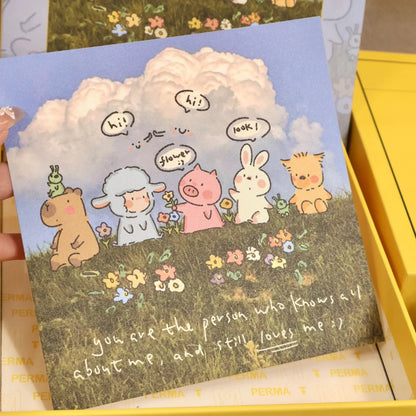 Matching art card of the animal friends under the fluffy cloud inside the puzzle box.