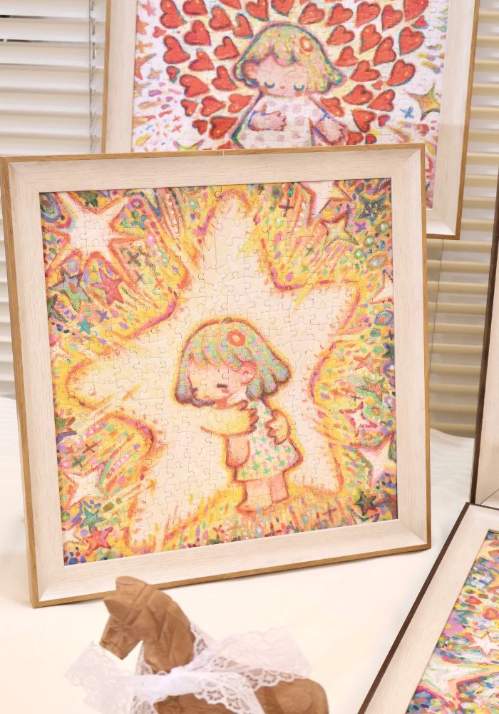 Close-up of framed The Hugging Star puzzle showing vivid details of stars and soft colors.