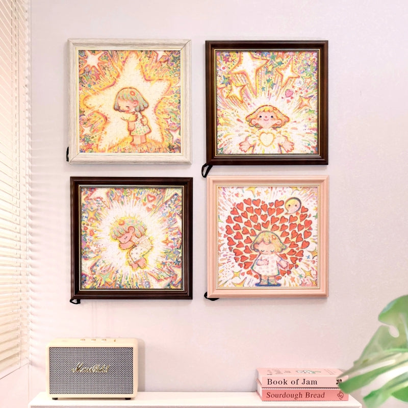 Wall display of four framed PERMA Tiny Me Series puzzles, including The Hugging Star.
