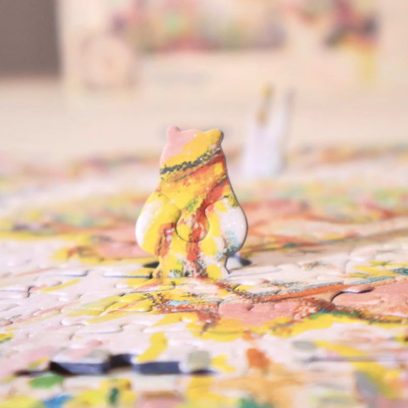 Close-up side view of a special-shaped puzzle piece standing upright within the completed puzzle.