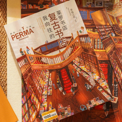 Cardboard stand-up reference sheet of the Livraria Lello puzzle artwork lying beside loose puzzle pieces.