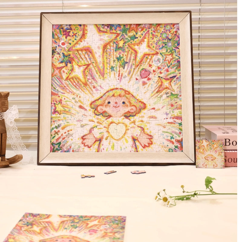 Completed “Tiny Me, Mighty Power” jigsaw puzzle framed on a table with bright starburst artwork and smiling character.