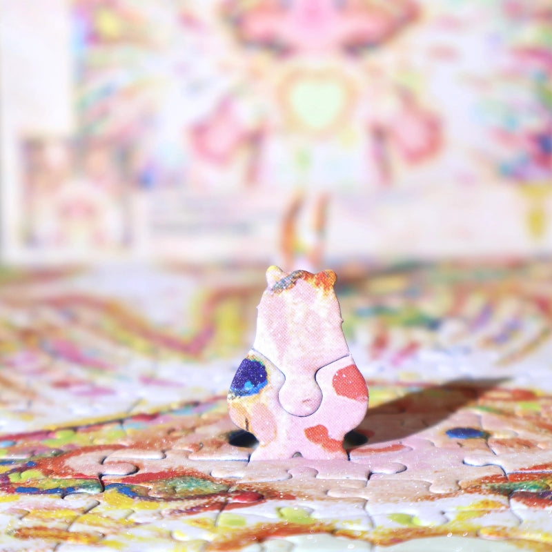 Close-up of a uniquely shaped bear puzzle piece standing upright on the completed puzzle.