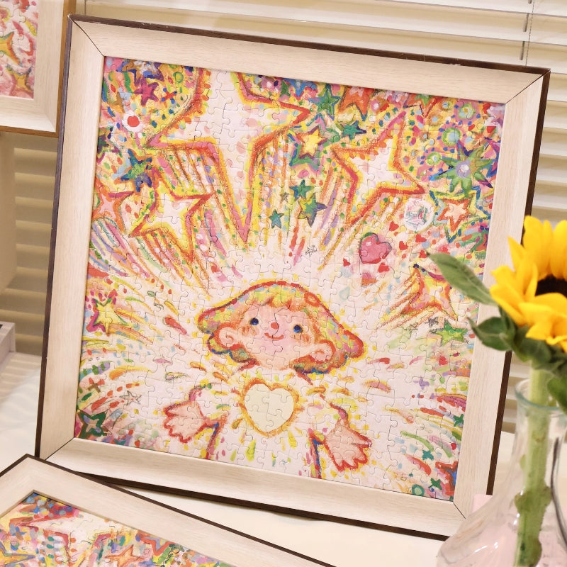 Framed completed “Tiny Me, Mighty Power” puzzle displayed beside a sunflower in a vase.