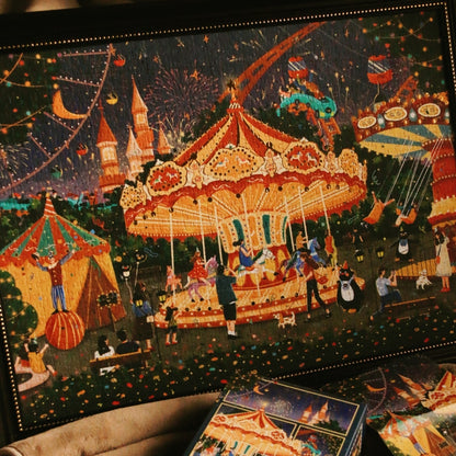 Framed completed puzzle of Pinpin Theme Park carnival scene.