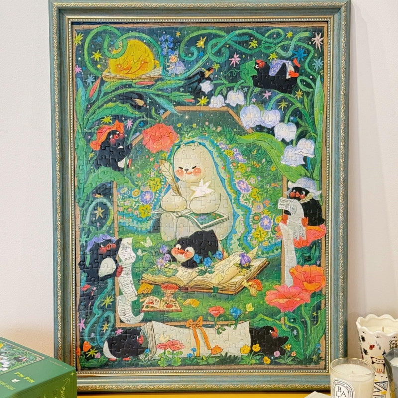 Completed Bedtime Story 520 piece jigsaw puzzle framed, showing magical bear, penguins, and floral forest details.
