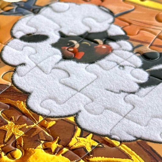 Close-up of Count Sheep jigsaw puzzle piece showing fluffy white sheep design with soft felt-like texture.