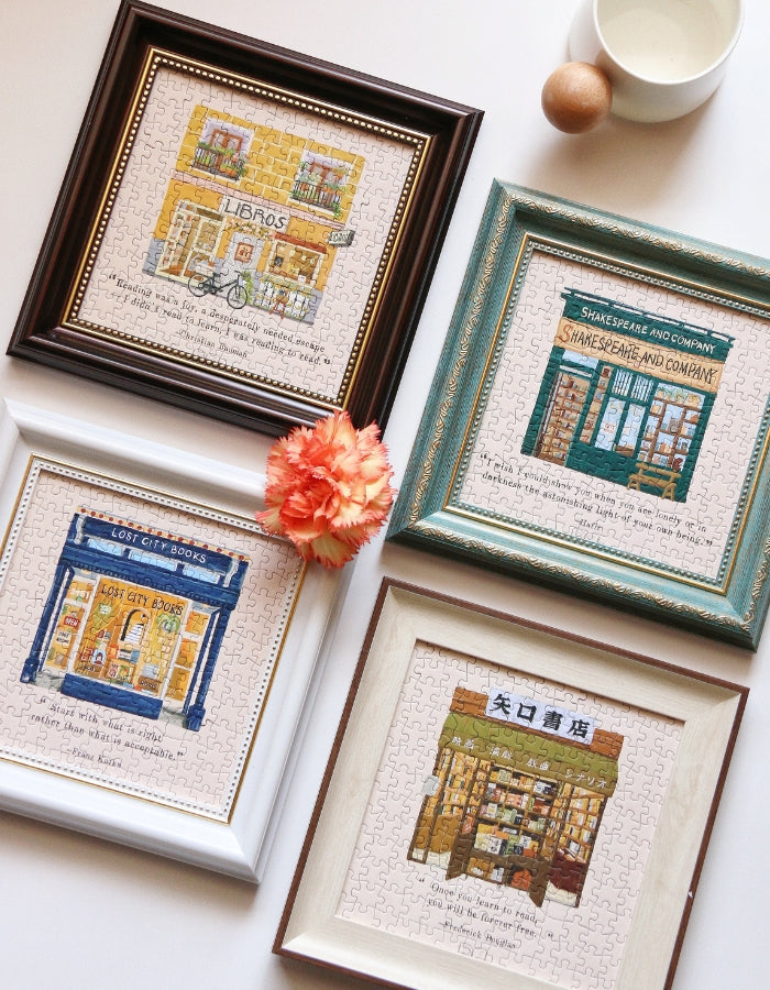 Four assembled Pin Pin bookstore puzzles side by side, including Libros and Lost City Books.
