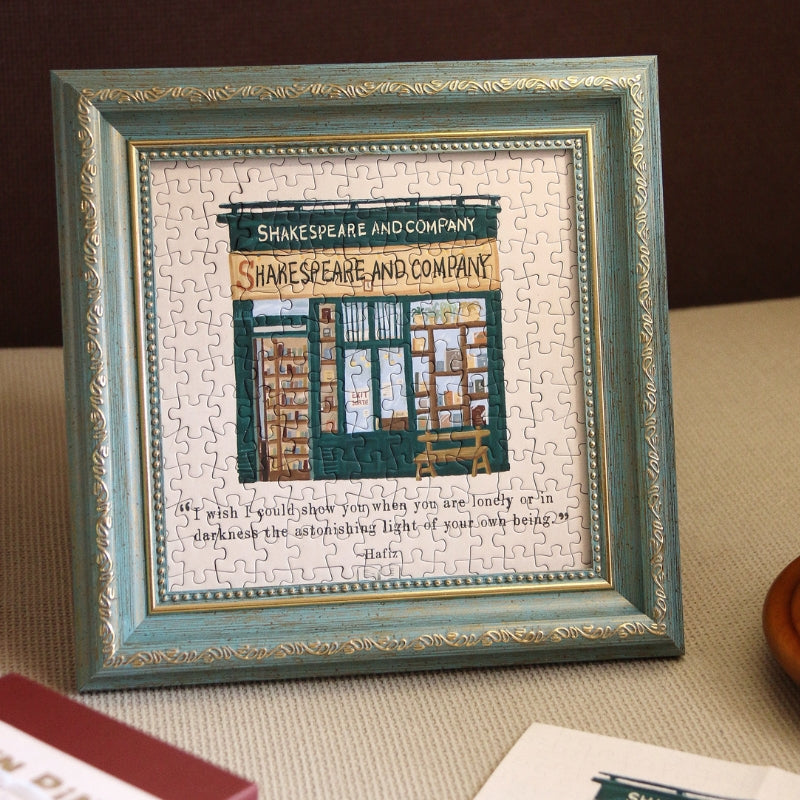 Framed completed Shakespeare and Company mini puzzle displayed as wall décor.