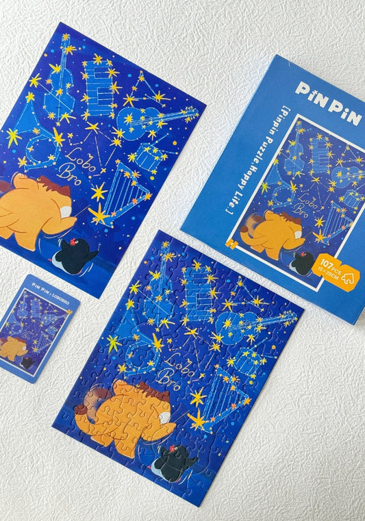Close-up of completed Star Sign Lobobro puzzle showing constellations shaped like instruments in a navy blue sky.
