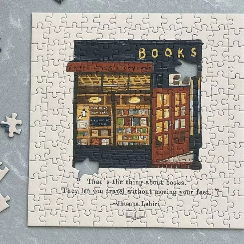 Partially assembled Three Lives & Company bookstore puzzle with Jhumpa Lahiri quote.
