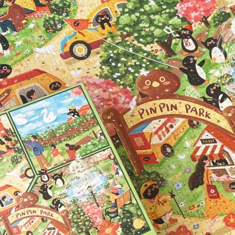 Pinpin Garden Party jigsaw puzzle in progress with vibrant details of park entrance, penguins, and cherry blossom trees.