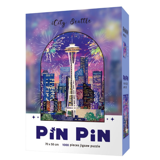 Pinpin iCity Seattle puzzle box featuring Seattle skyline with fireworks and the Space Needle, 1000 piece jigsaw puzzle.