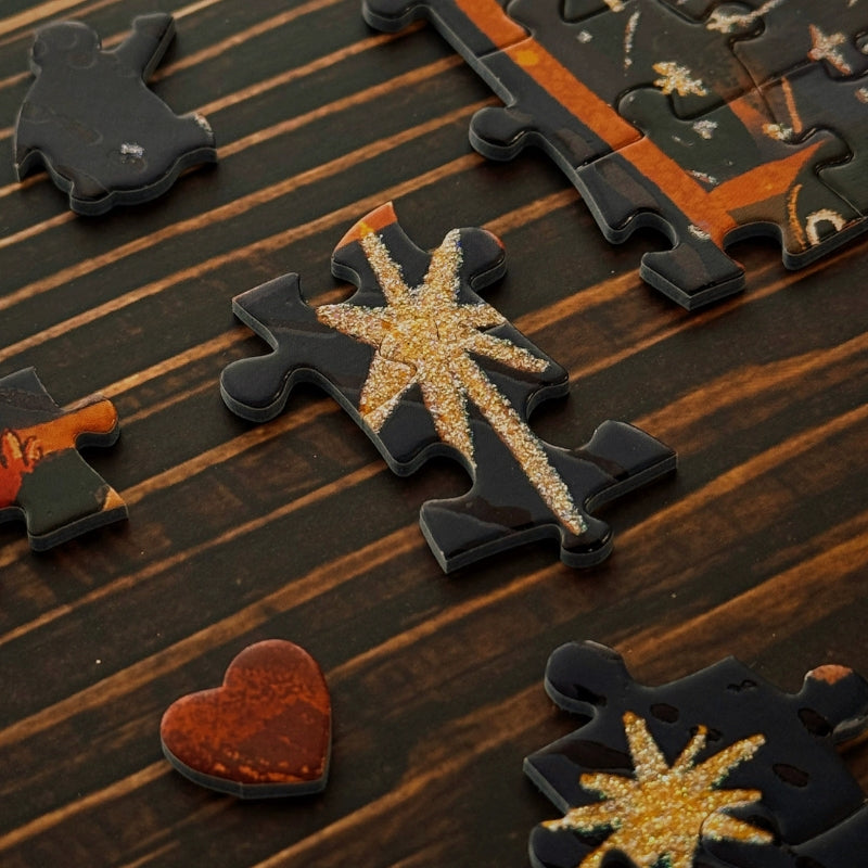 Close-up of Sweet Dream puzzle pieces showing glitter details and unique heart-shaped piece.