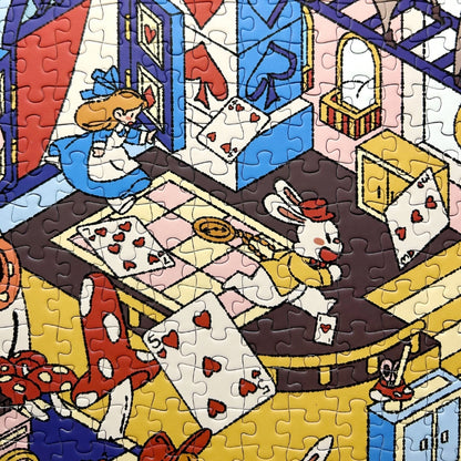 Close-up of Alice’s Wonderland puzzle showing Alice chasing playing cards and a rabbit in a detailed fantasy setting.